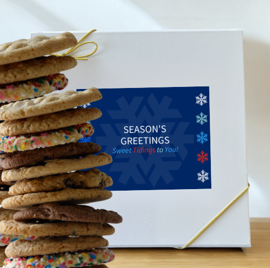 Season's Greetings box beside cookie stack